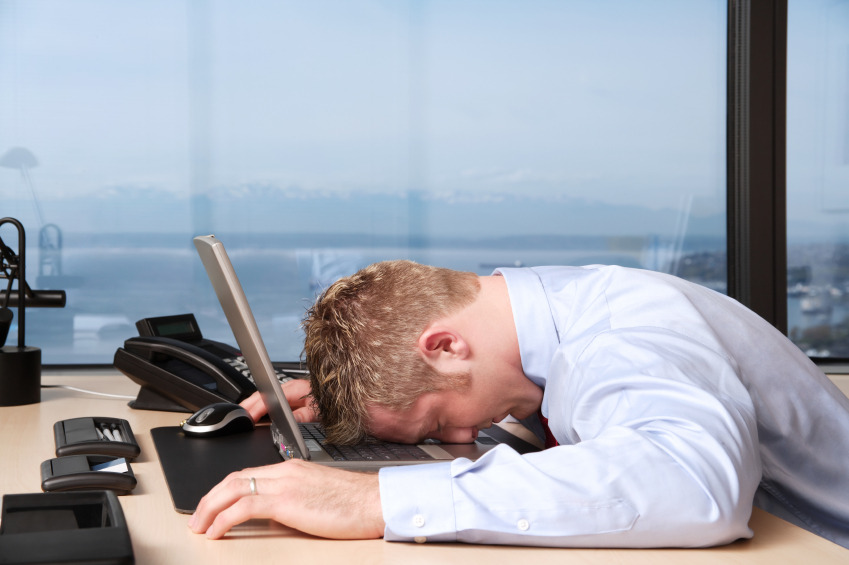 Men lying on the keyboard because of stress